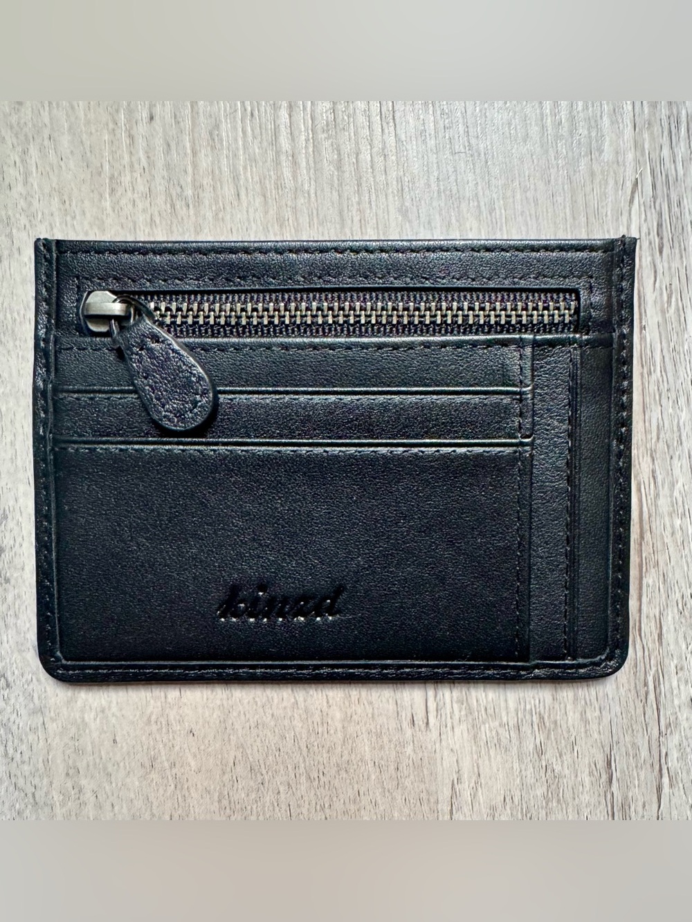 Kinzd minimalist leather card holder by Kinzd, featuring a zippered compartment